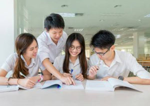 Group of students studying together in a hall