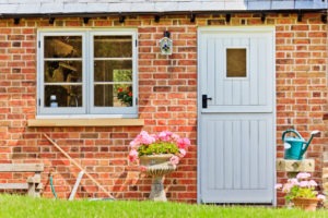A side profile of a brick cottage