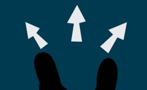 Arrows pointing outwards from two heads