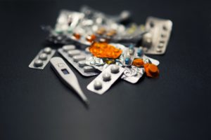 Sealed medicine pills and a thermometer