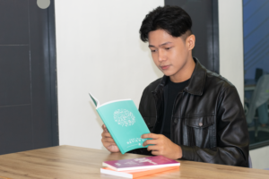 A student reading AHEAD's test-based review kit