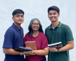 A group of students carrying learning materials