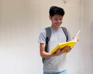 A student reading while standing