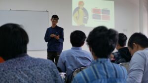 A student presenting in front of their class