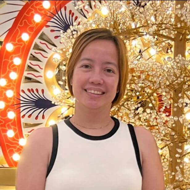 A headshot picture of a smiling person